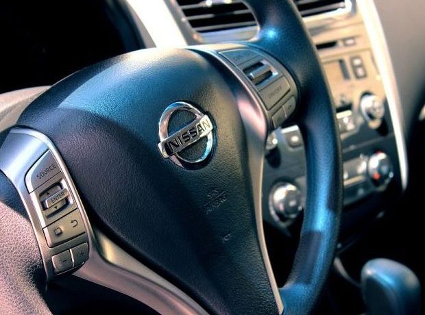 close up of a nissan steering wheel